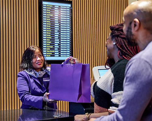 Couple collecting their items from a collection desk