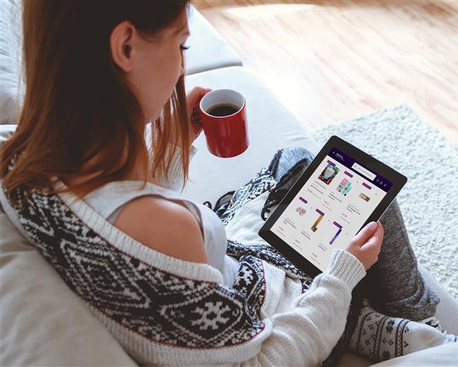 Woman browsing Reserve & Collect website on an ipad