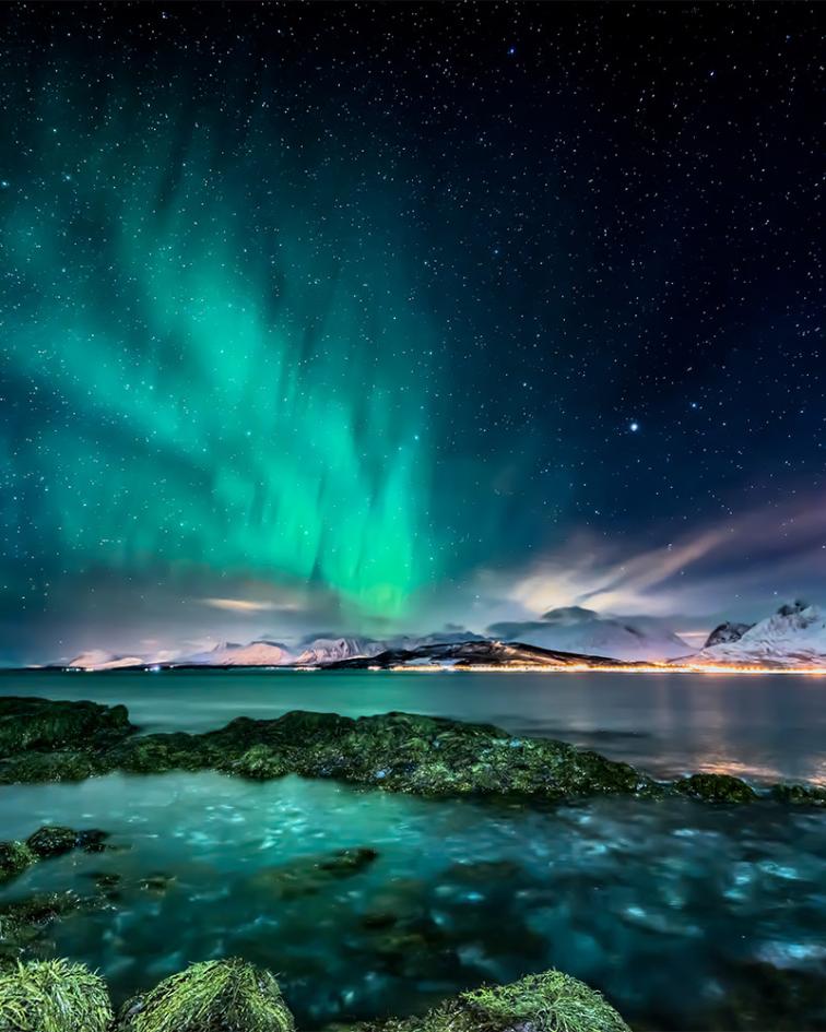 Amazing aurora borealis - northern lights - view from coast in Oldervik, near Tromso city - north Norway