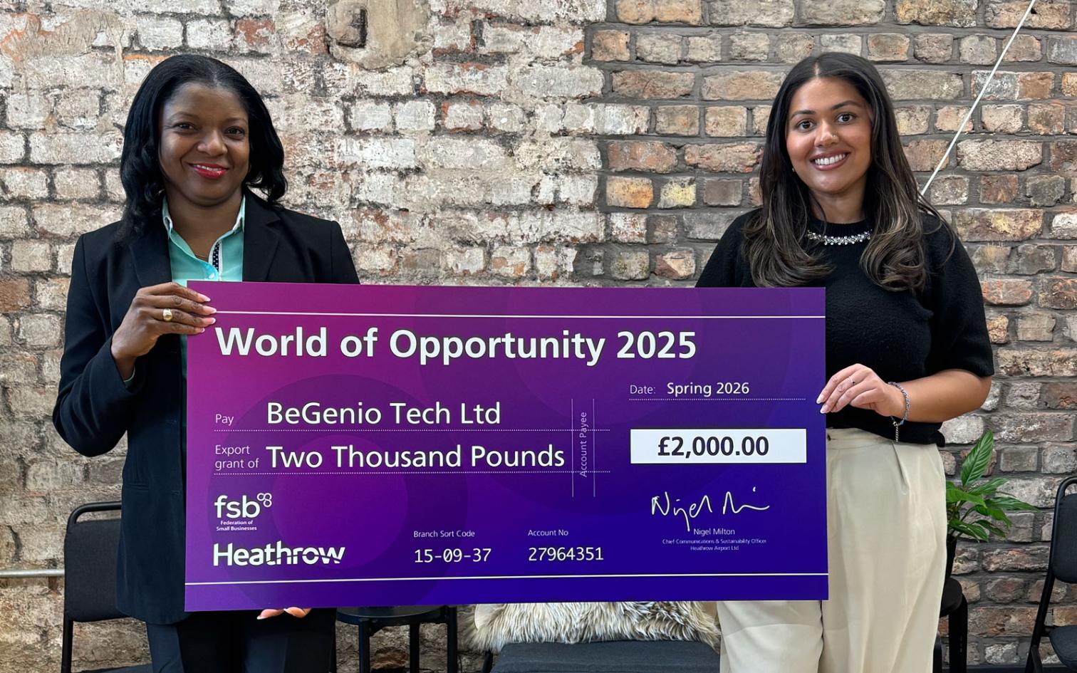 BeGenio - collecting the grant check from Heathrow representitive