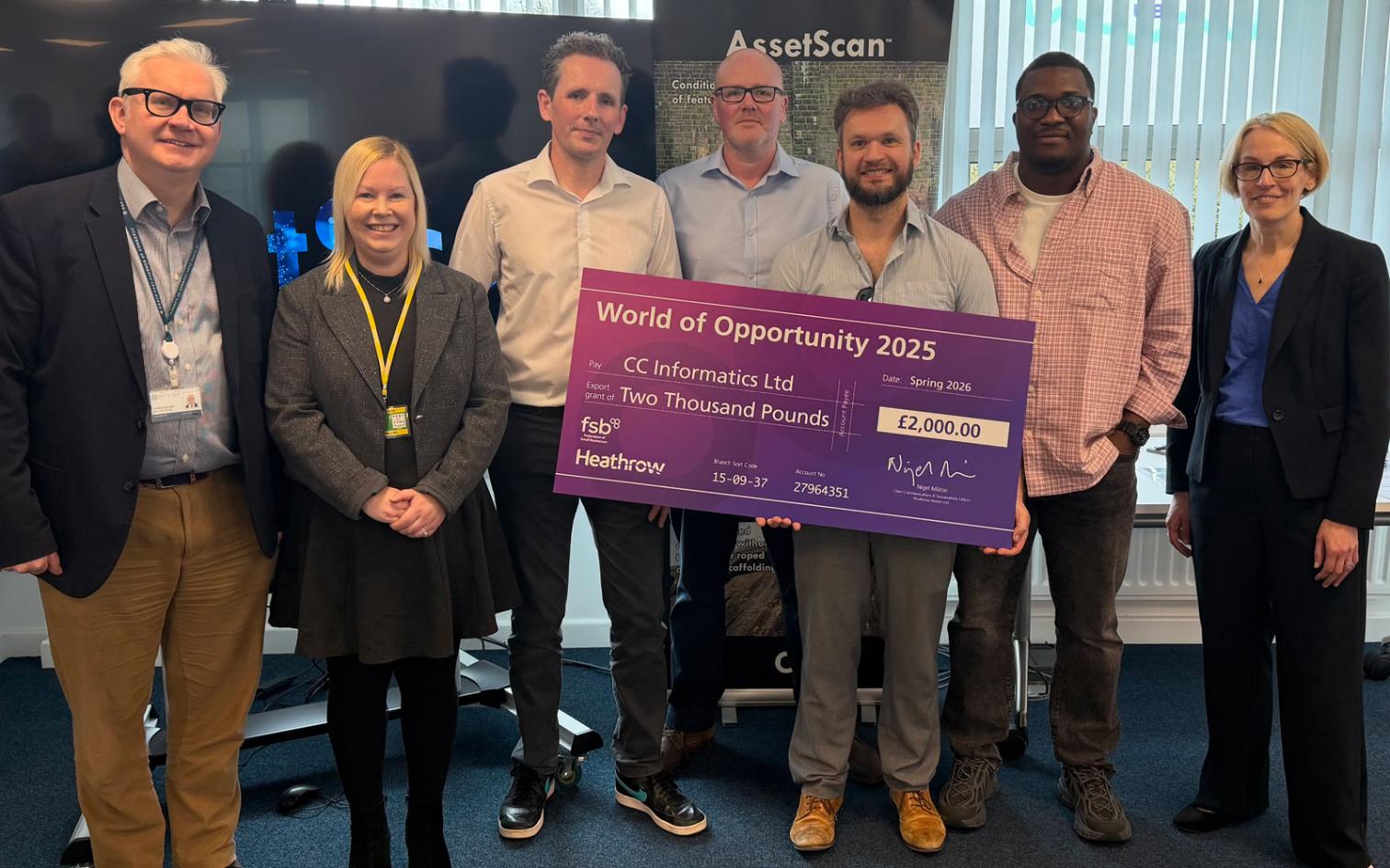 CC Infomatics - collecting the grant check from Heathrow representitive