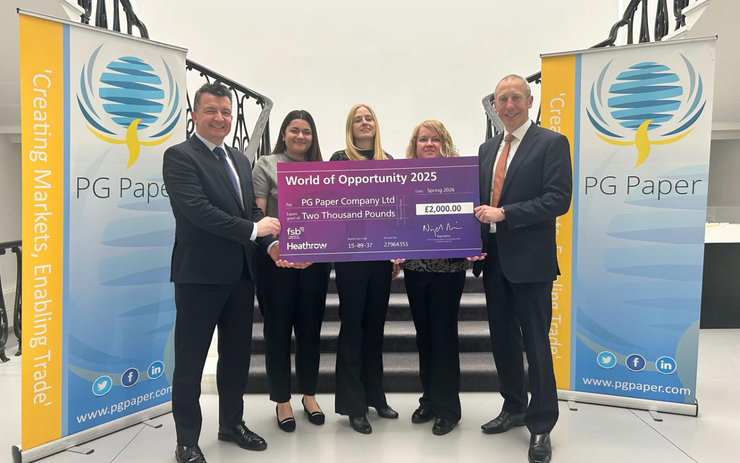 PG Paper - collecting the grant check from Heathrow representitive