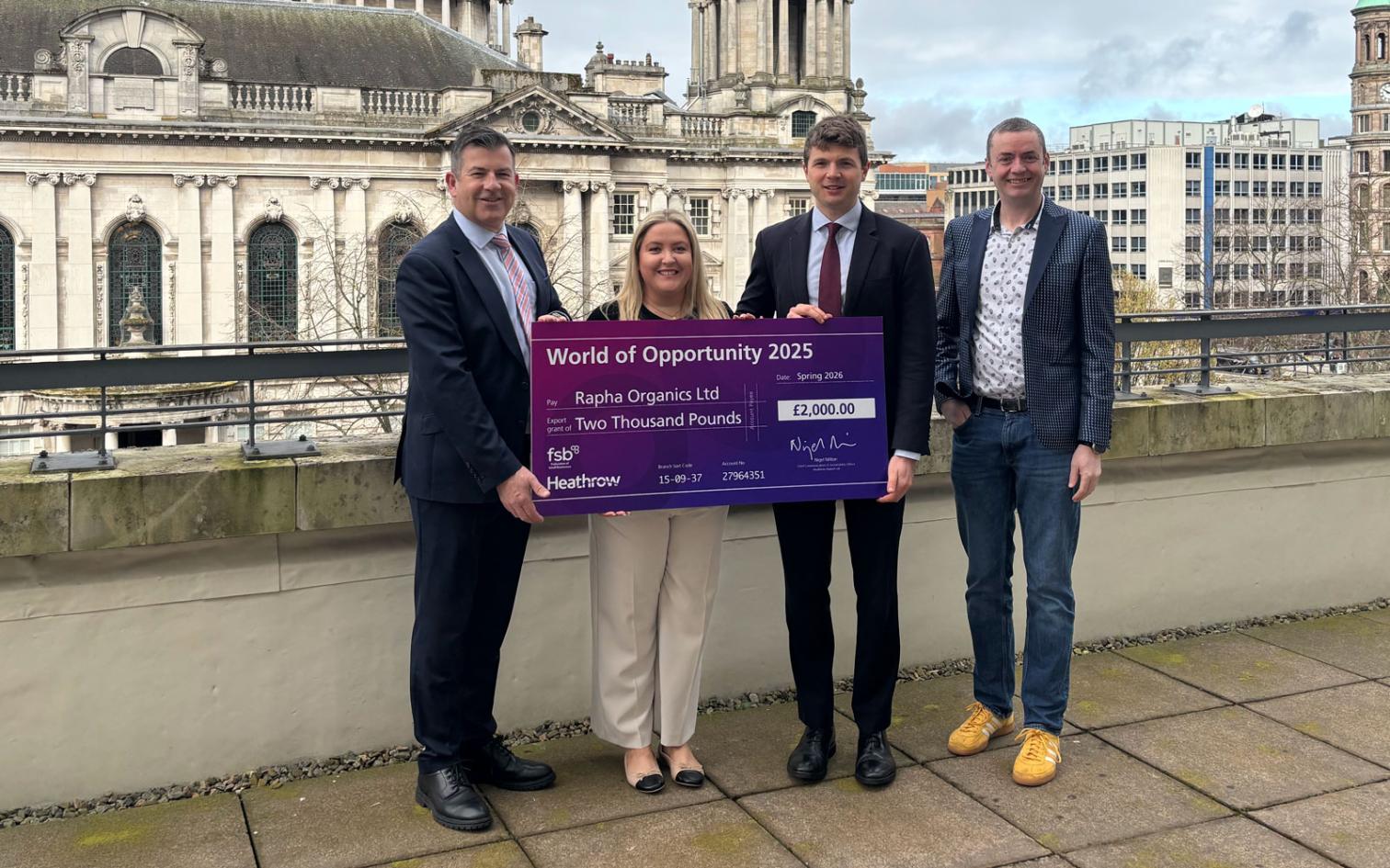 Raphs Organics - collecting the grant check from Heathrow representitive