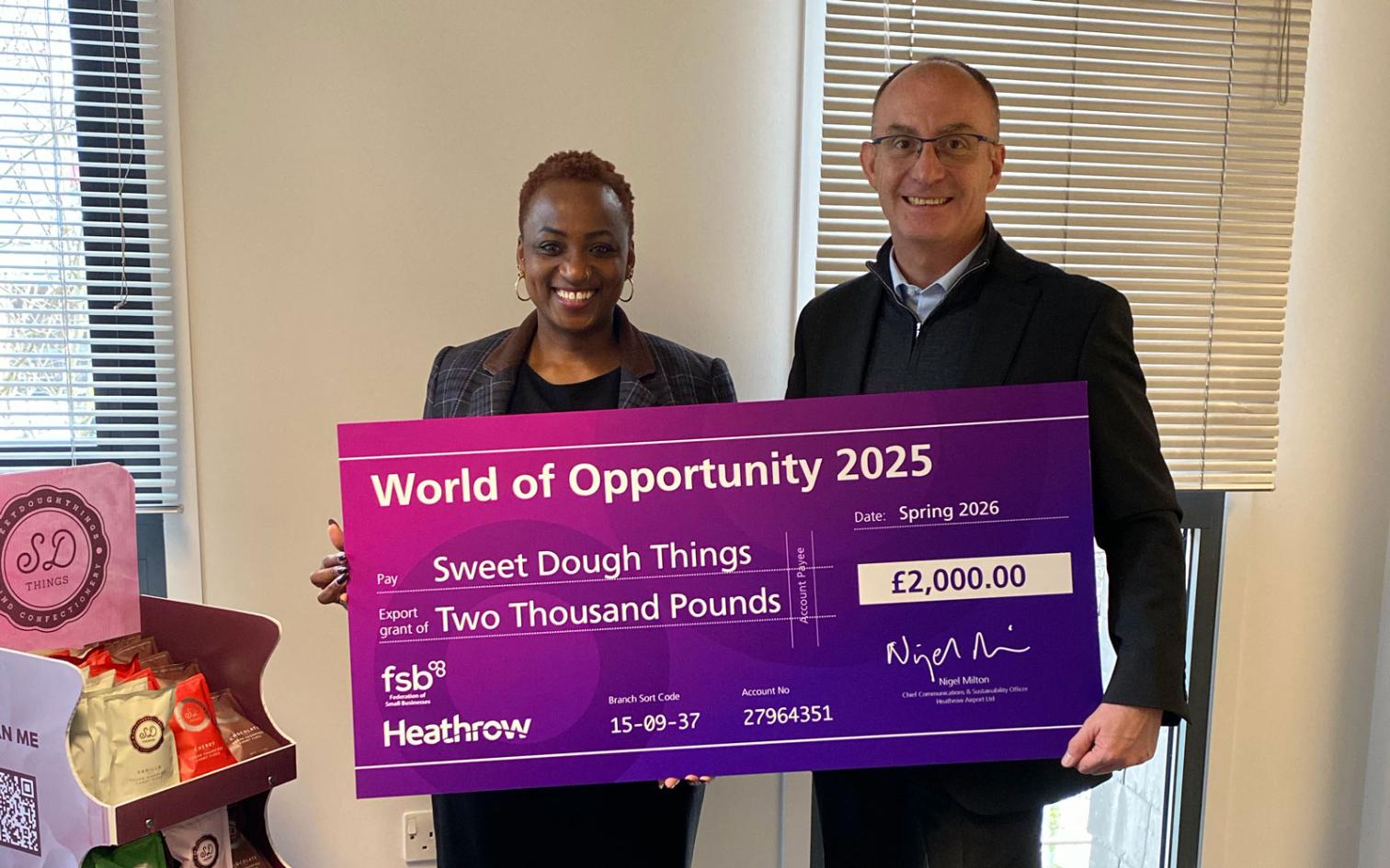 Sweet Dough Things - collecting the grant check from Heathrow representitive