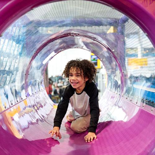 Cild playing in soft play area ay Heathrow