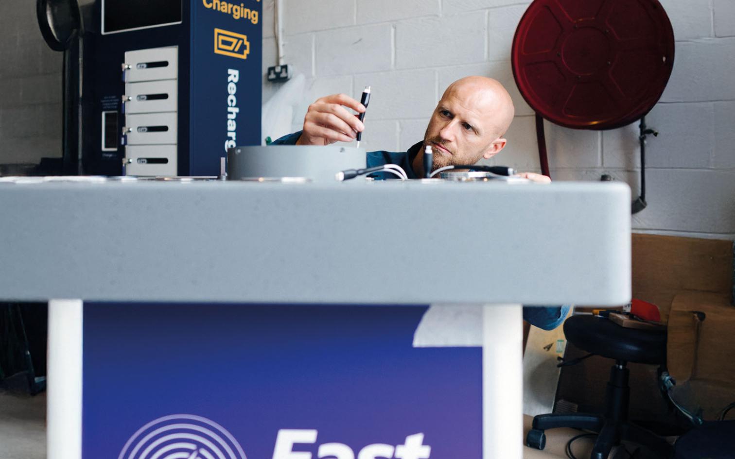 Chargebox engineer working on device charging unit